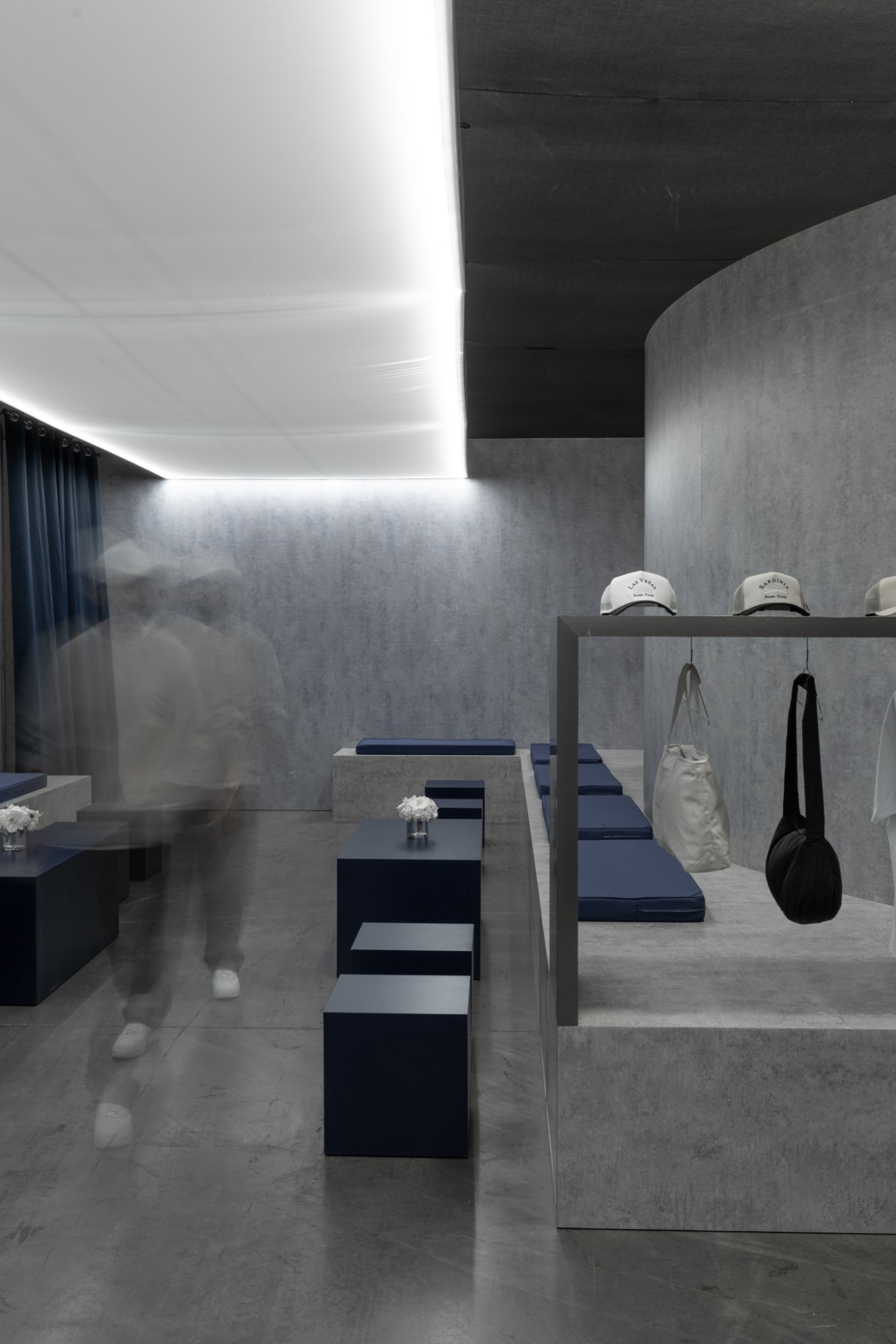 Guests moving through the lounge past the merchandise display