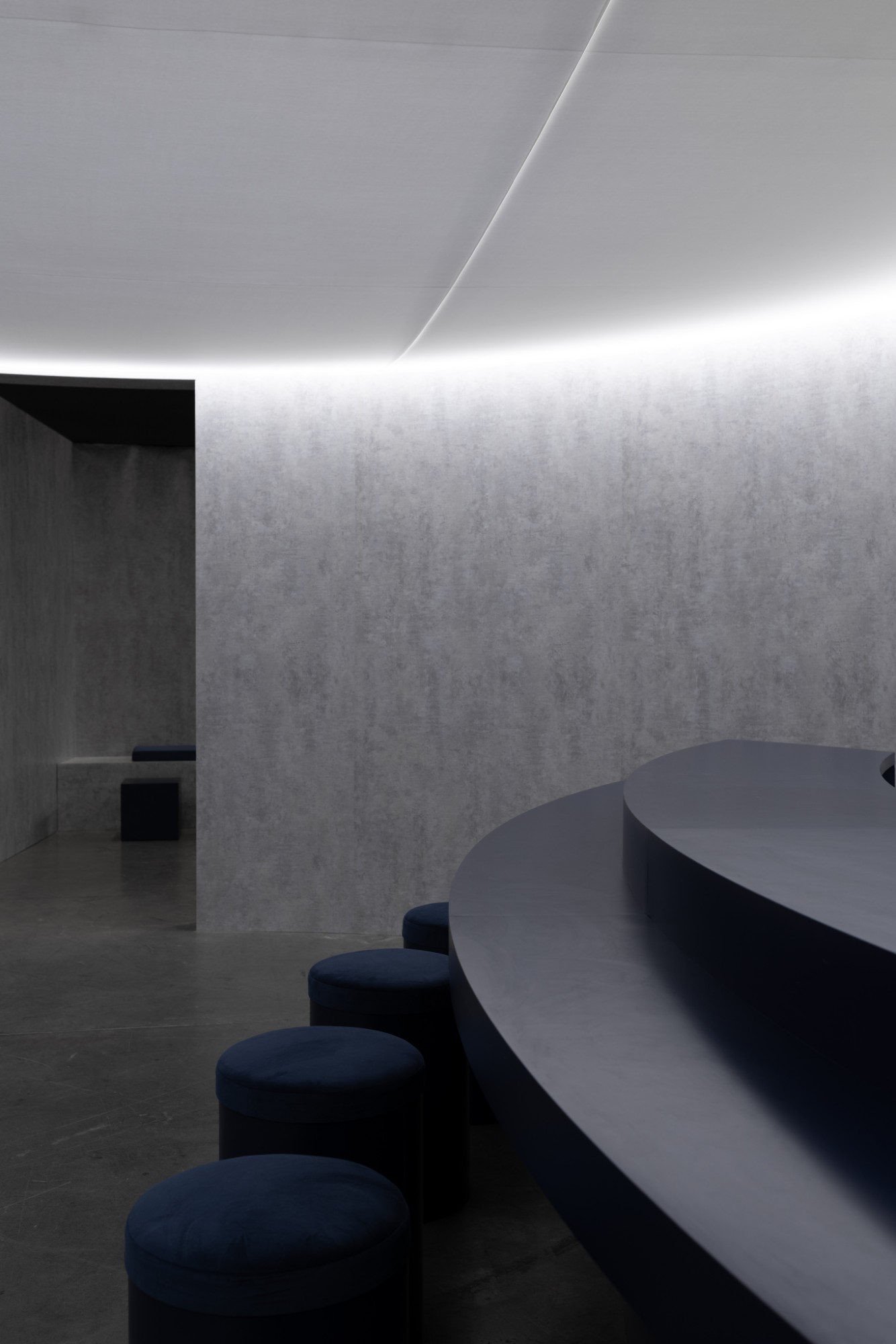 The sushi bar with the lounge visible through an opening